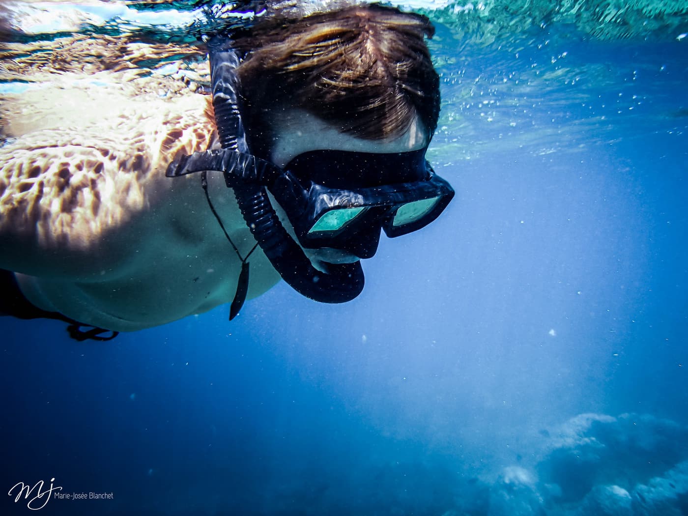 A snorkeller under water in Fiji