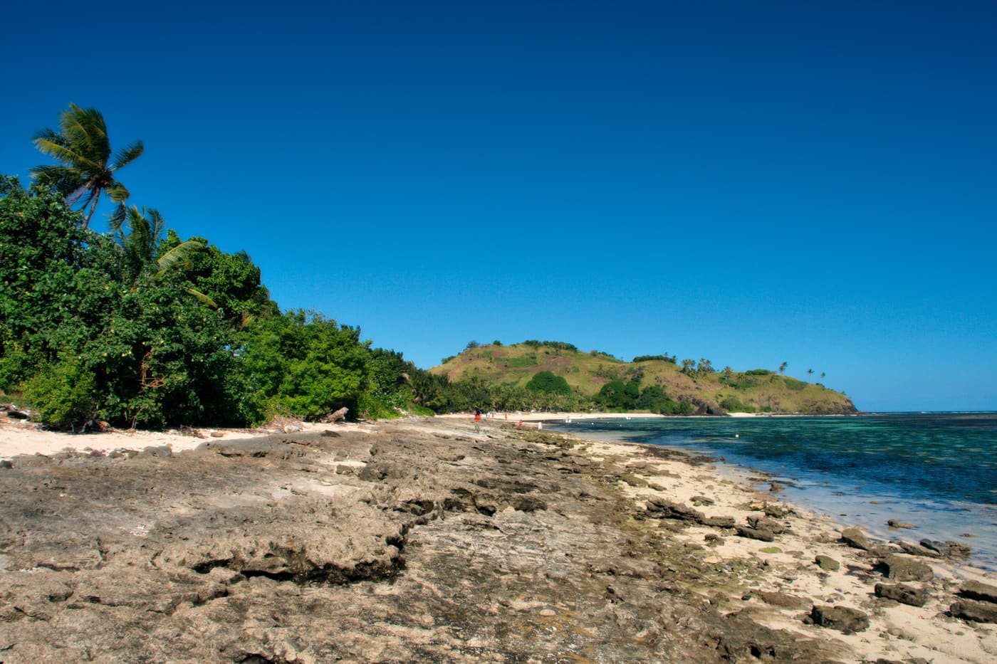 Rocky shoreline on Yanuya, the island whose villagers own Monuriki